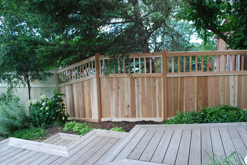 Wood privacy fence installed along a residential backyard